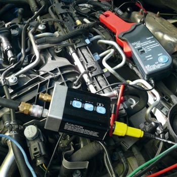 Diagnostic equipment in the engine compartment of a car
